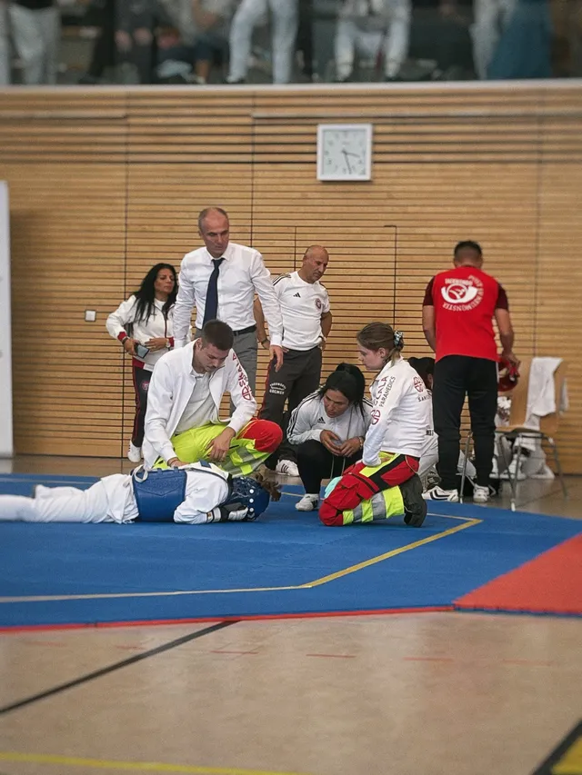 SKALA Paramedics medics treating an athlete on the mat at a taekwondo tournament